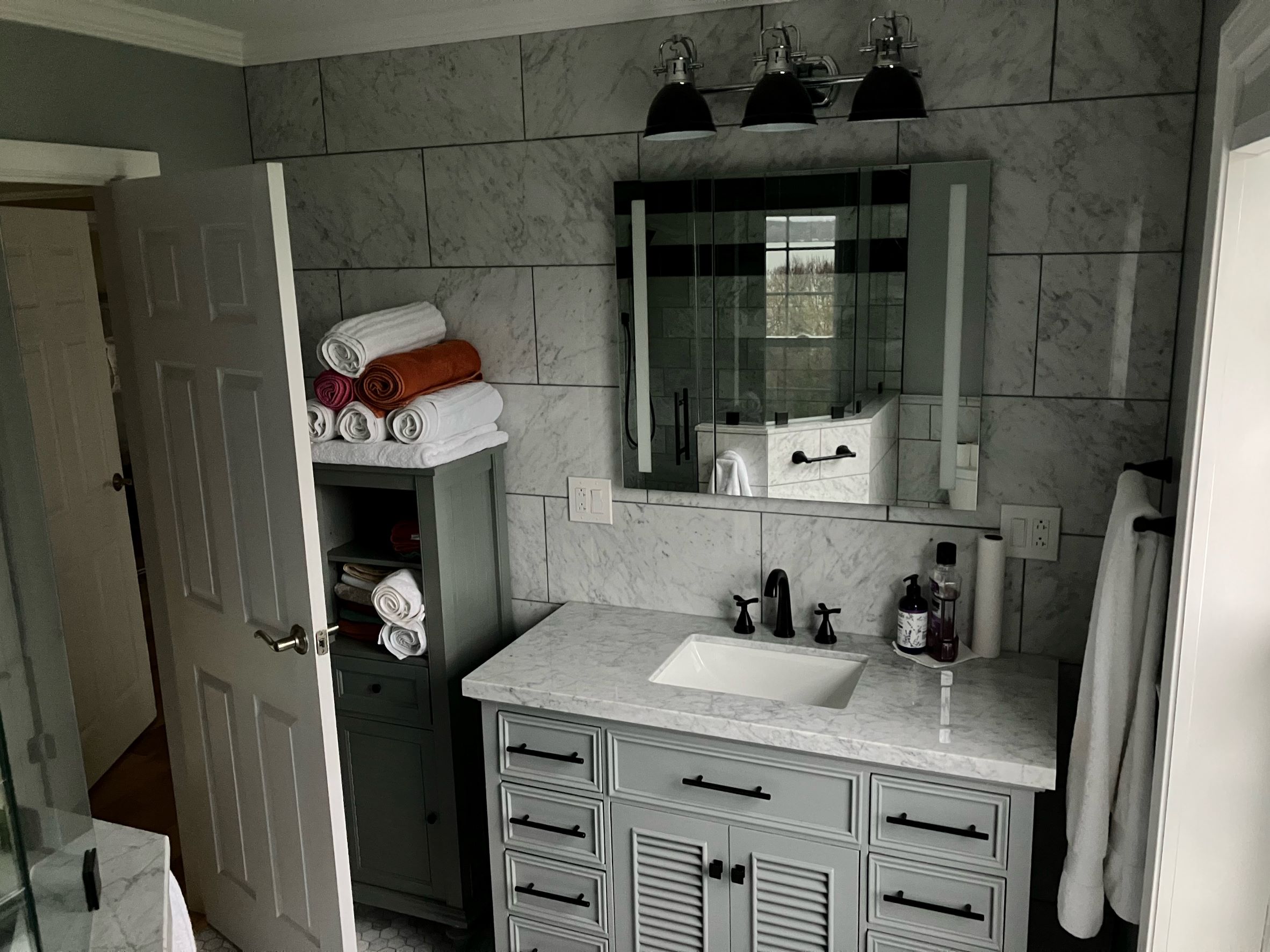 Custom Marble Wall with Recessed Lighted Makeup Mirror + Medicine Cabinet